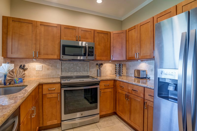The warmth of the wood, the sleek appliances—this kitchen is where style meets everyday convenience