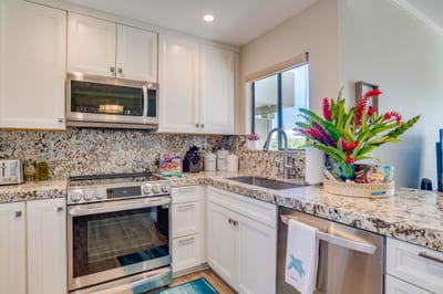 The scent of fresh fruit, the hum of the blender, and the soft breeze from the open lanai—this kitchen brings every moment to life KGV-17T5