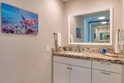 Between the clean white palette and ocean-themed accents, this bathroom is a continuation of the island escape you came for KGV-17T5