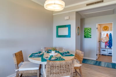 Dine with island elegance—set against a backdrop of cool tones, natural textures, and sweeping views beyond the lanai KGV-17T5