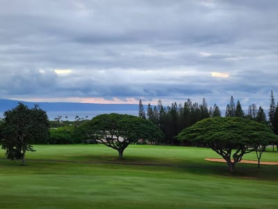 Mornings here begin with soft light on rolling greens, while the distant islands whisper promises of calm and wonder KGV-17T5