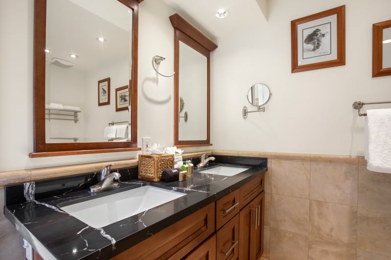 A timeless double-sink setup, plush lighting, and cozy shower space make this your private slice of island luxury KGV-17V3