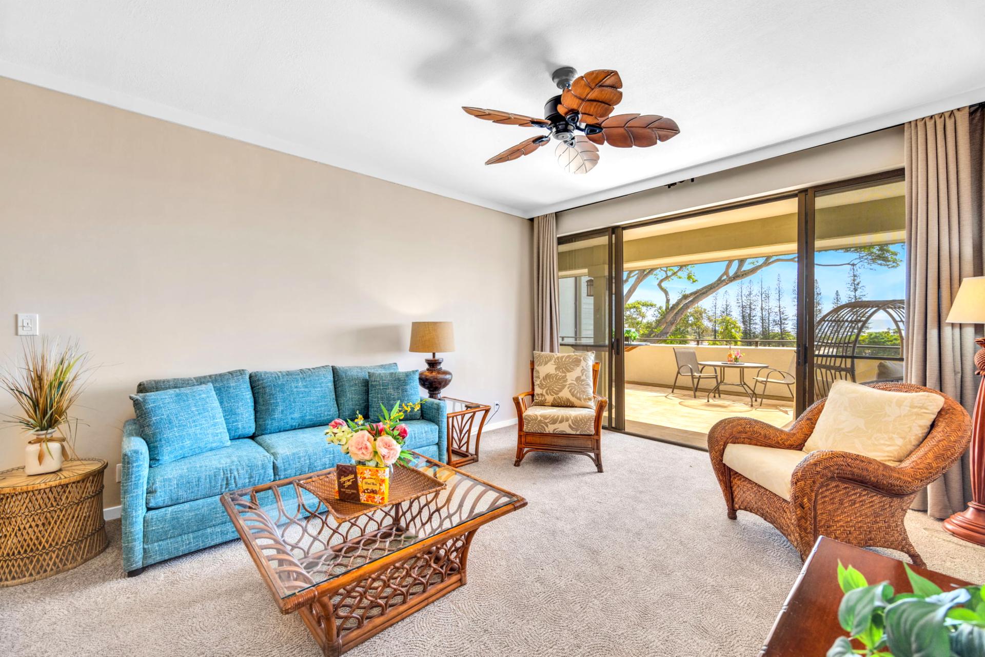 Cozy and inviting, the living room offers ample seating, ceiling fan, and easy outdoor flow.