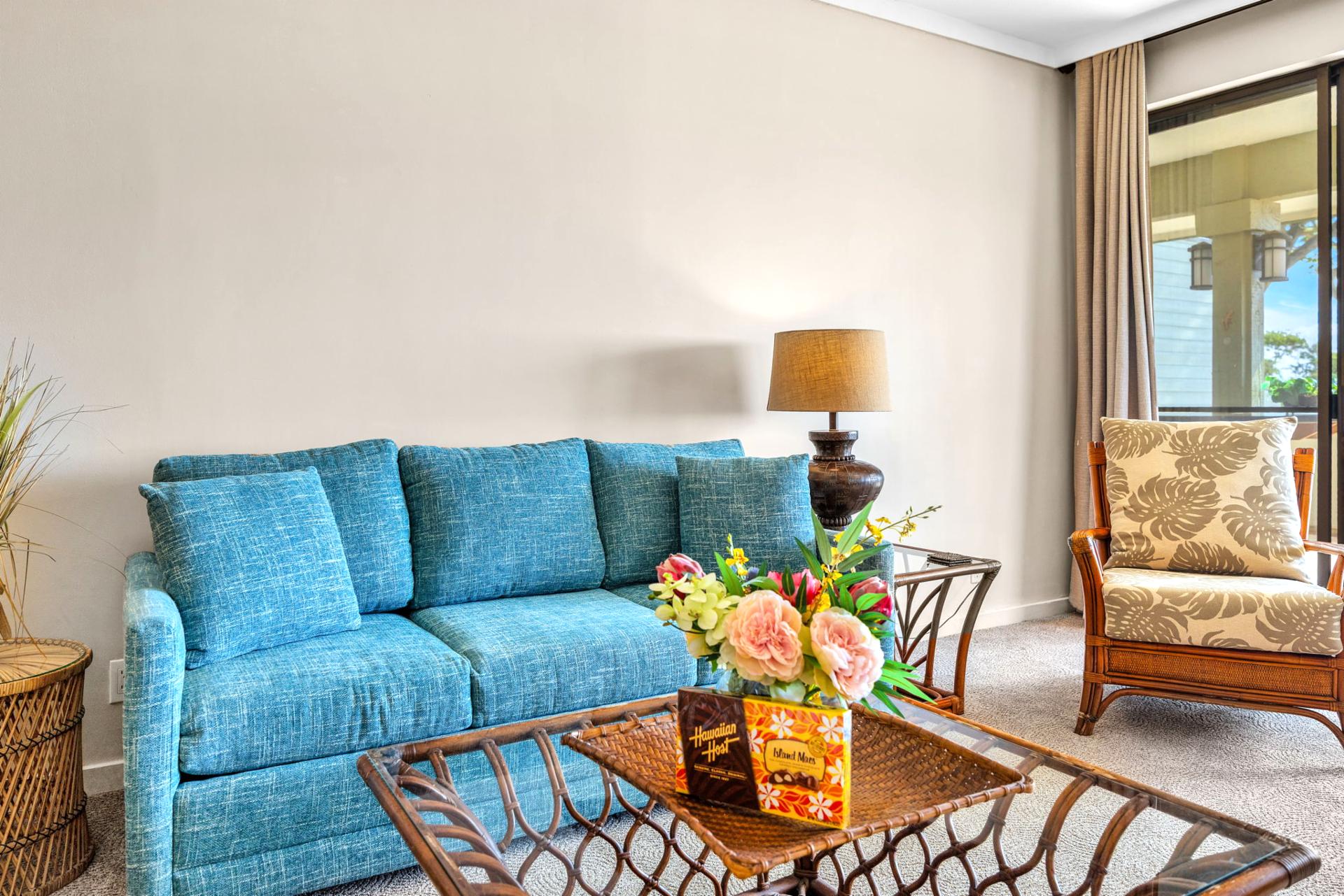 Light-filled living space with tropical touches and plush seating opens to the resort-view lanai.