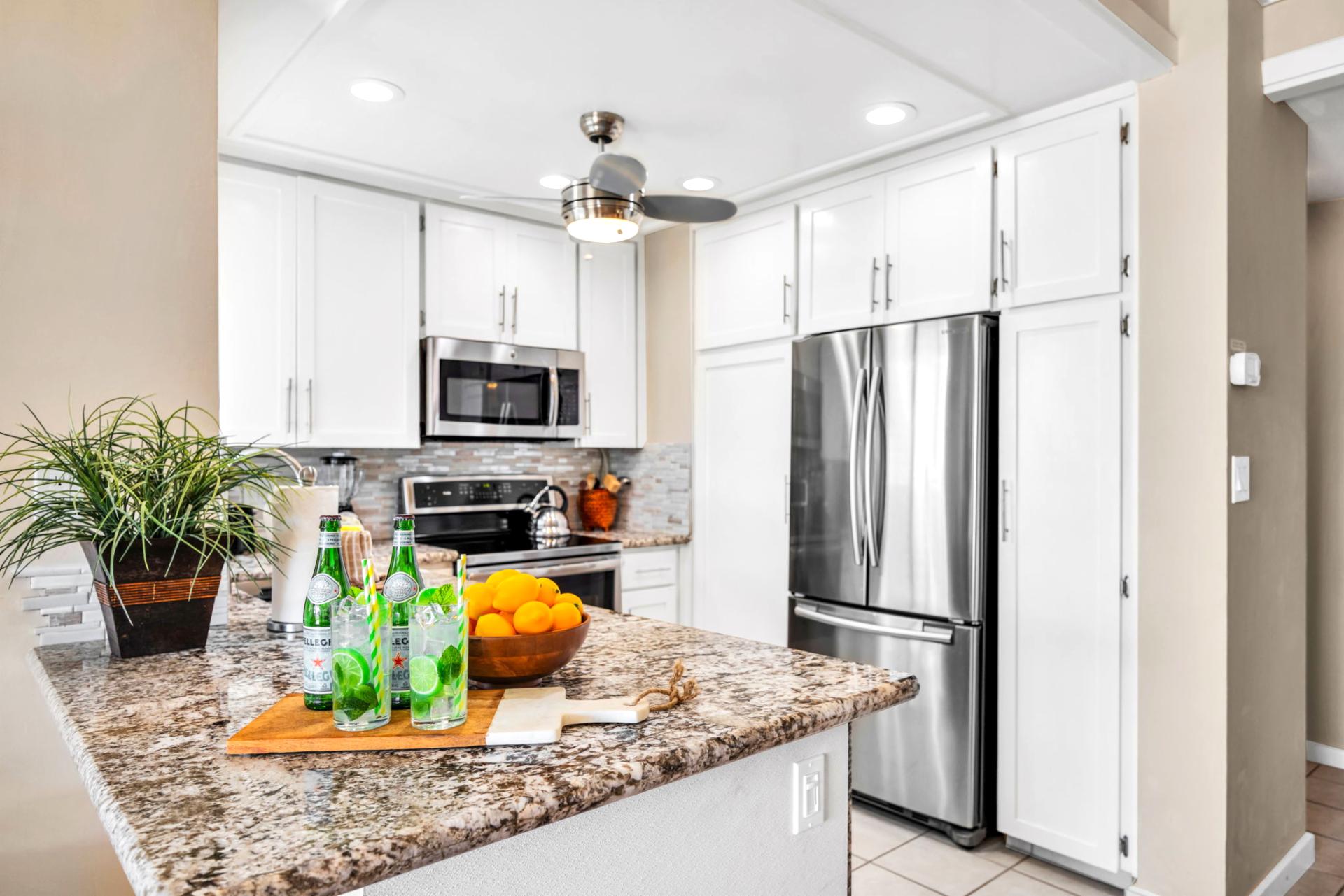Bright and functional kitchen with modern appliances and thoughtful layout for vacation cooking ease.