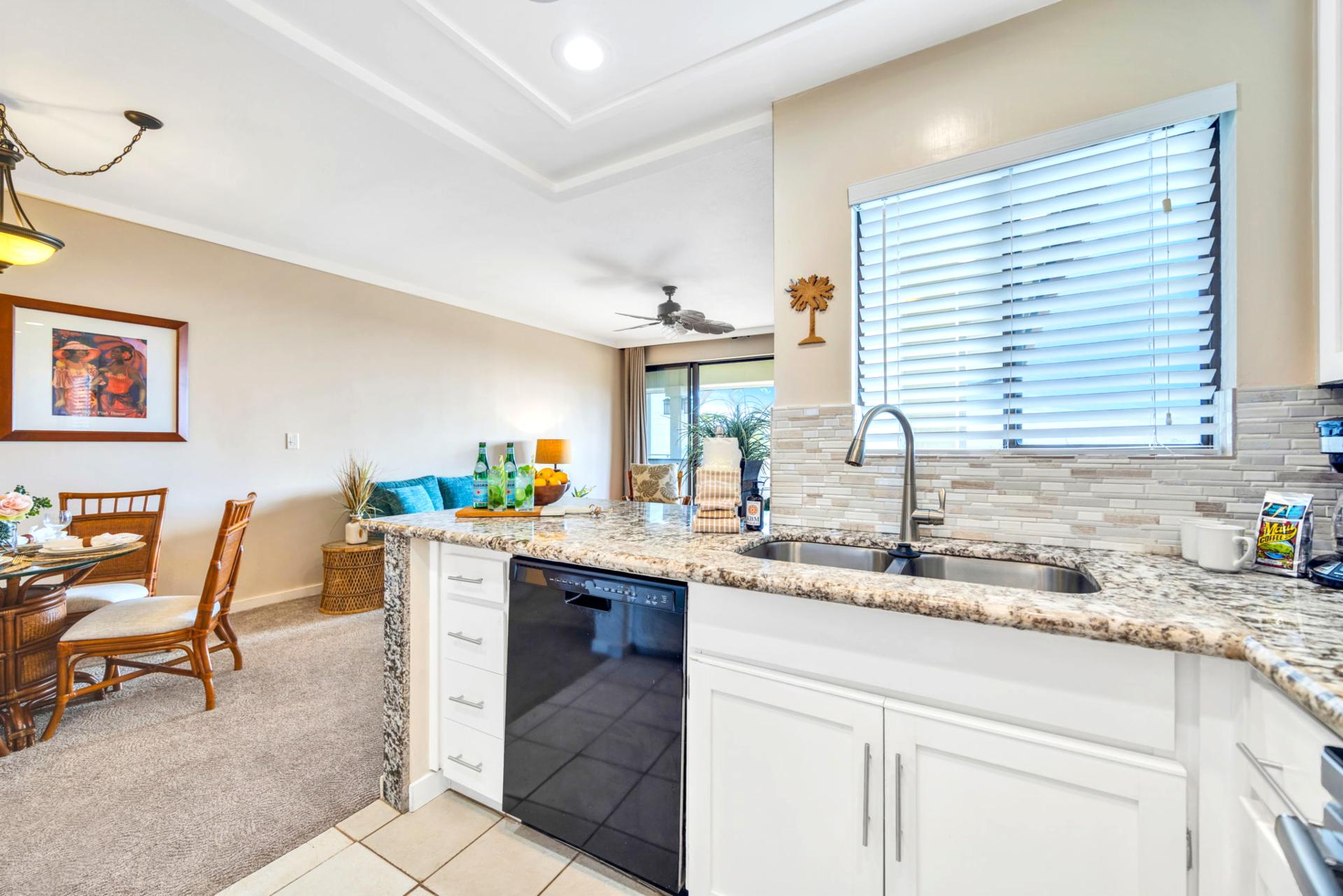 Island kitchen layout keeps meals and conversation flowing in the open-concept living space.