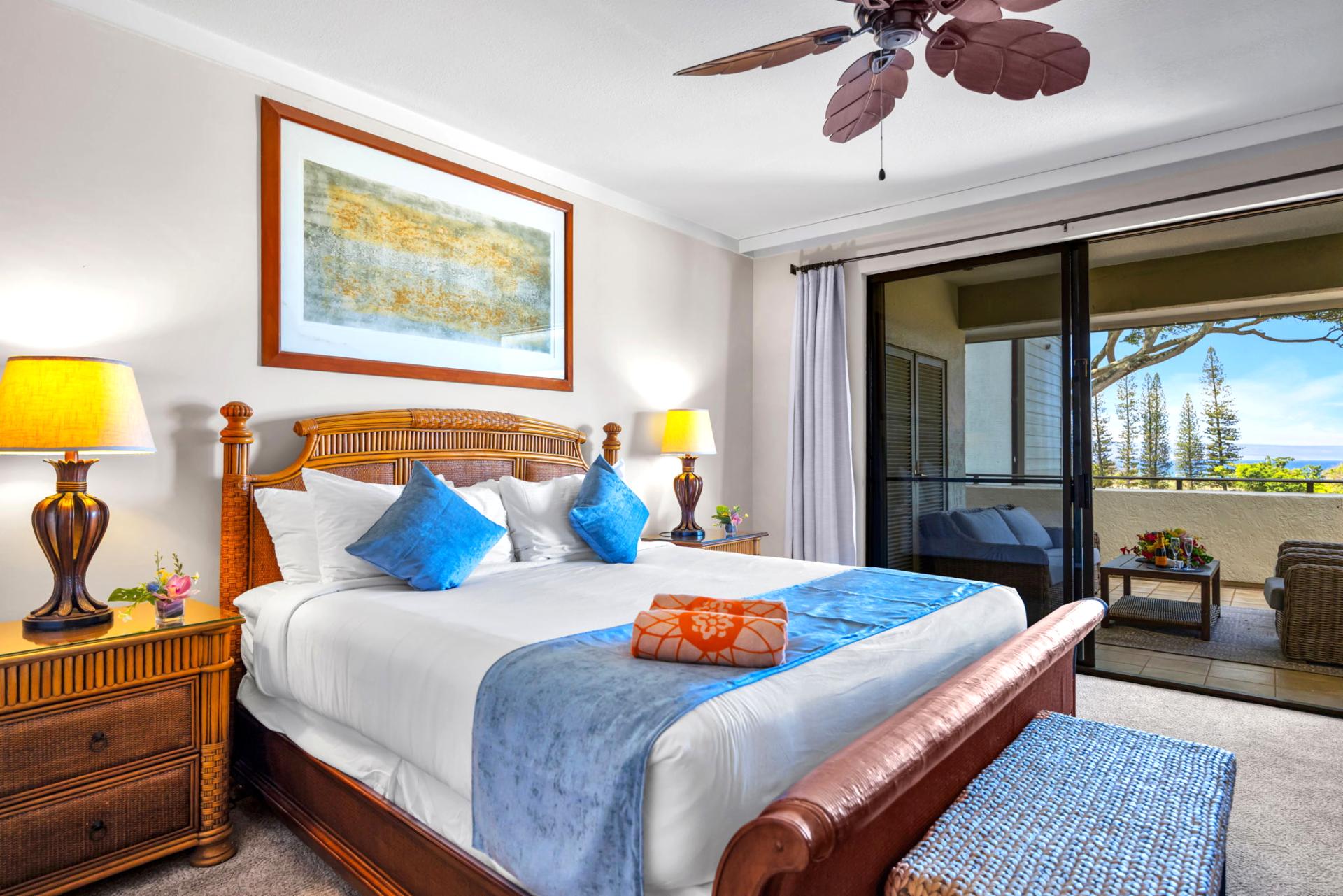 King bed, ceiling fan, and direct lanai access create a restful retreat with golf course views.