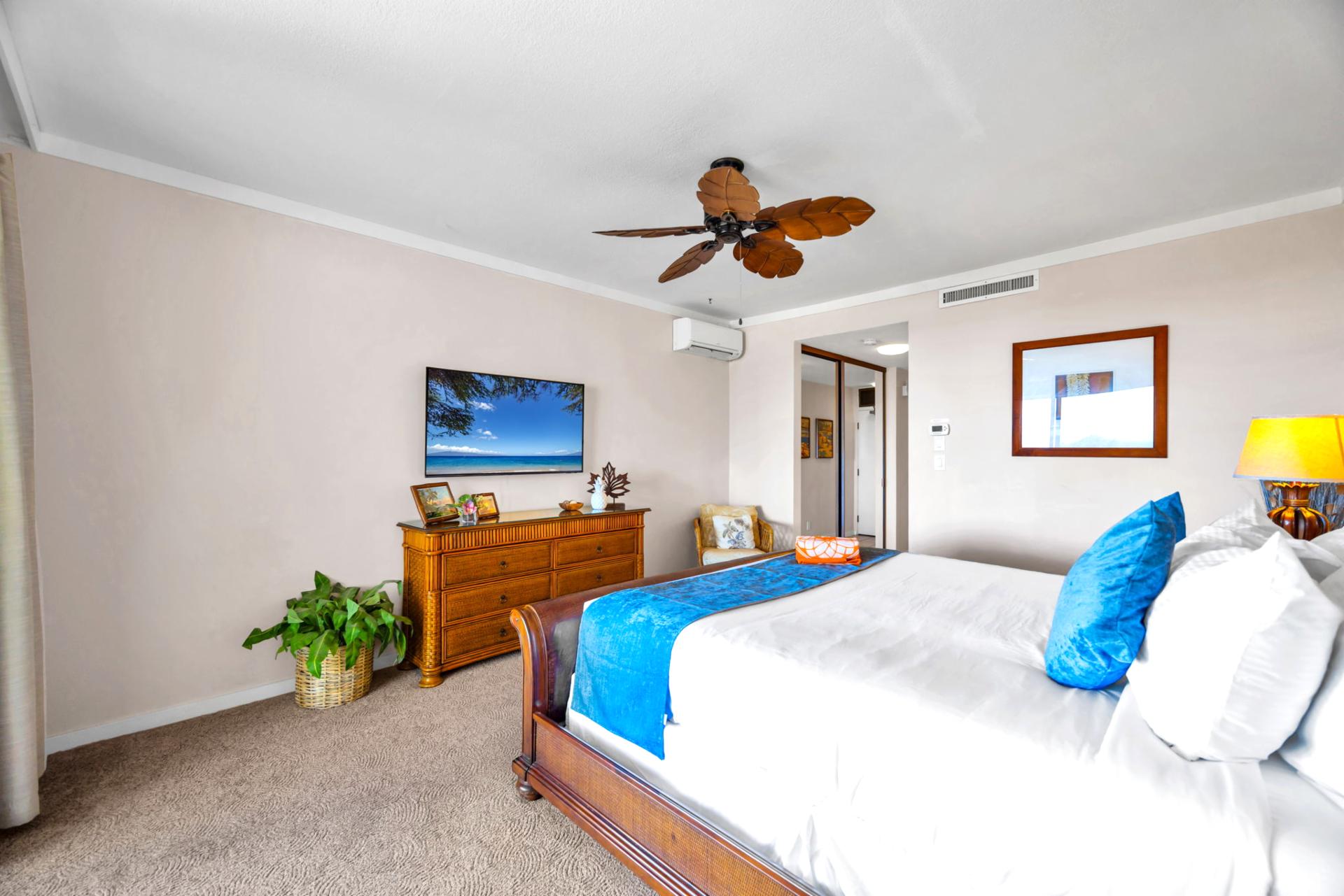 Soft lighting, ceiling fan, and King bed ensure restful nights in this relaxing primary suite.
