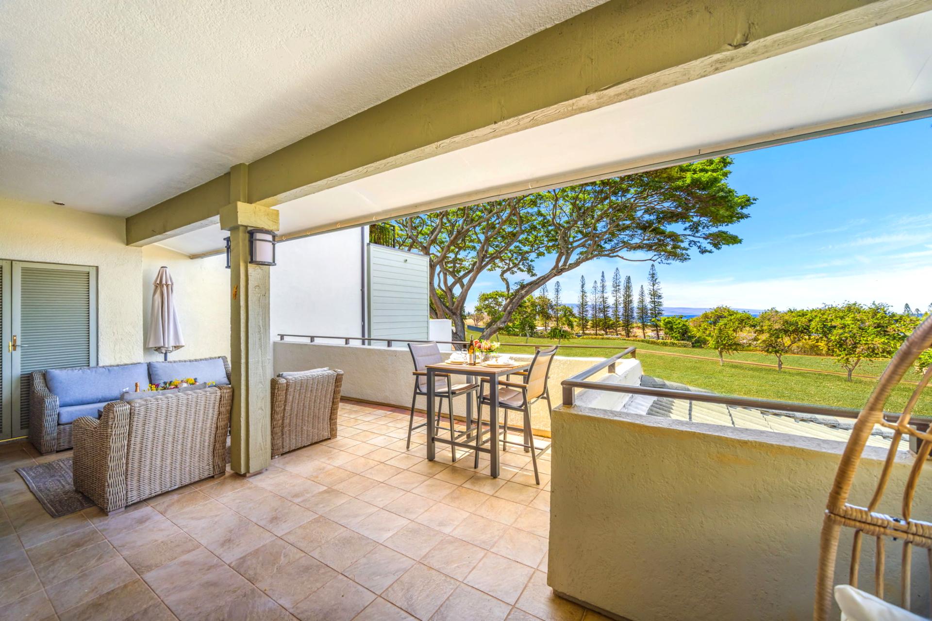 Covered lanai with panoramic resort views. Ideal for shaded midday lounging or evening stargazing.