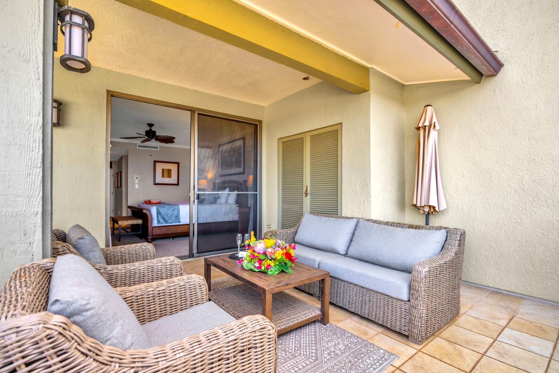 The lanai lounge area brings the outdoors in, with seating and views that extend your living space.