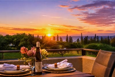 Sweeping sunset view over the Kapalua coastline, with the fairways and Pacific visible from your villa.