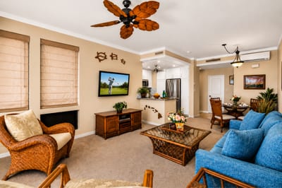 Gather in the living room, where natural light and a flat-screen TV make evenings just as inviting as the view outside.