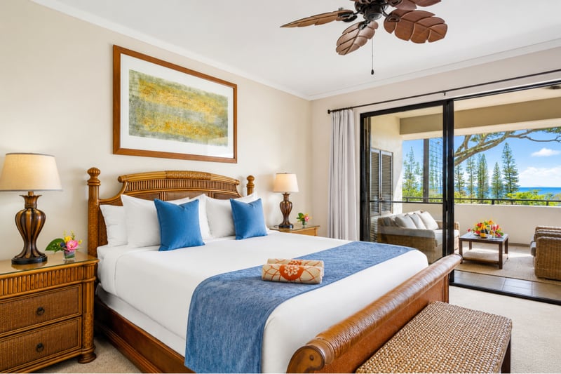 The king bedroom offers a comfortable retreat with ceiling fan, warm furnishings, and an ensuite bath just steps away. KGV-18T4