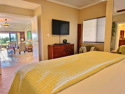 Sun spills across the bed, doors open to the breeze—this room whispers rest, recharge, and stay a little longer