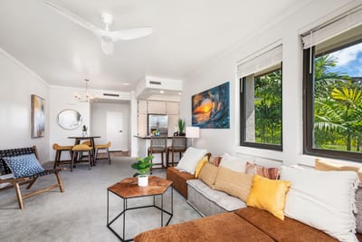 Elegant tropical vacation rental featuring modern design, open living spaces, lush views, and inviting comforts. KGV-20T2