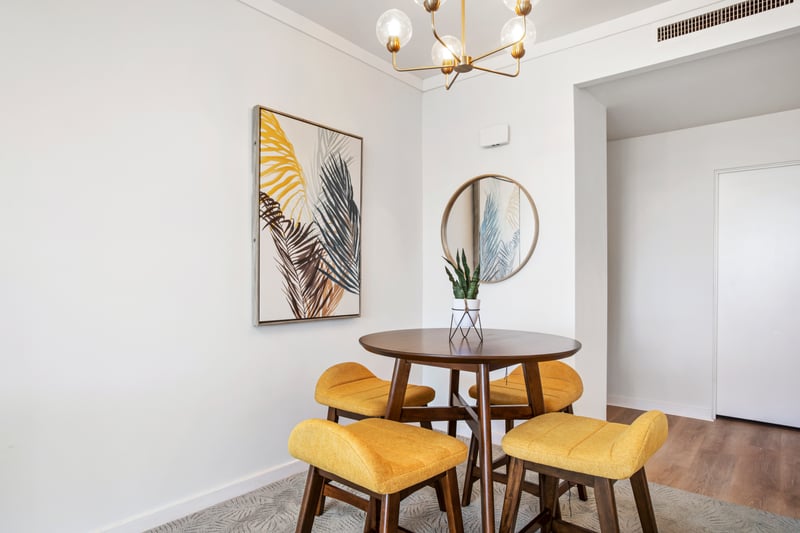 Gather around the warm-toned dining nook, where golden accents and cozy textures make every meal feel like a celebration    KGV-20T2