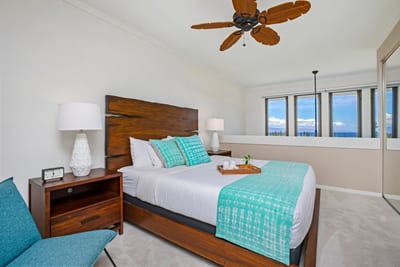 Relax in the primary suite featuring bold island artwork and natural light. KGV-20T8