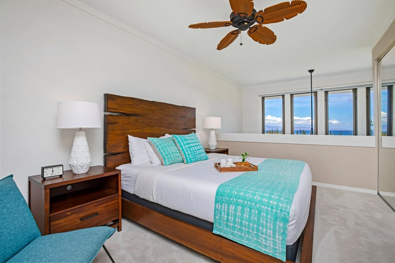 Relax in the primary suite featuring bold island artwork and natural light. KGV-20T8