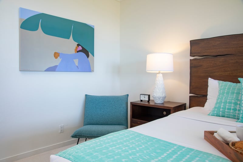 Soft hues and tropical flair highlight this peaceful master bedroom. KGV-20T8