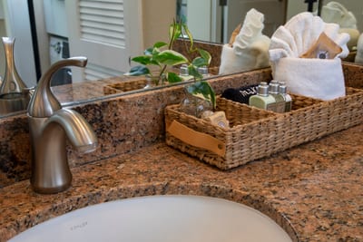 Luxurious bathroom with natural light and granite details. KGV-20T8