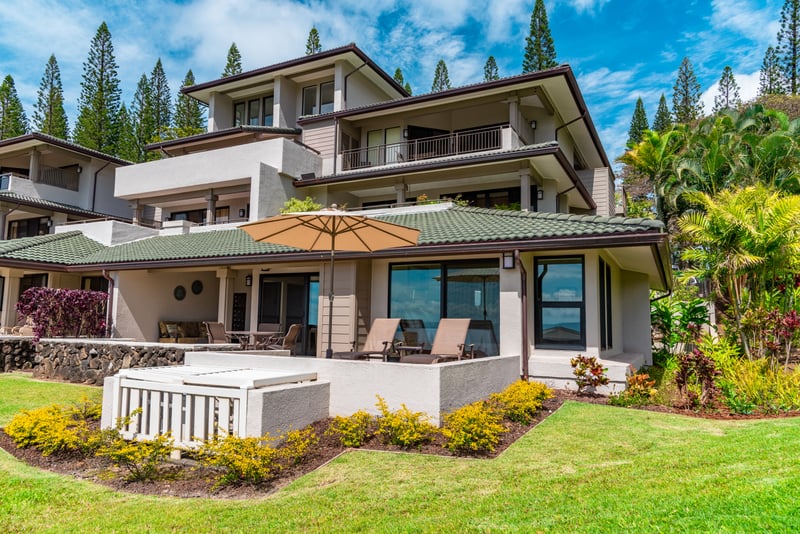 Dine, lounge, or daydream—this villa’s lanai is your private slice of paradise, framed by pines and floral blooms KGV-21P2
