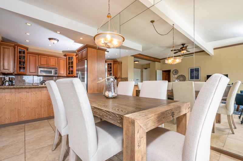 Gather around this rustic-chic dining table with plush seating, perfect for family meals, game nights, or casual island brunches