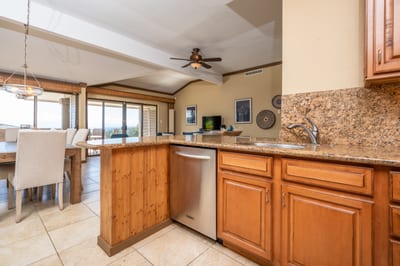 Cook, connect, and unwind in this beautifully appointed kitchen where timeless wood cabinets meet modern convenience