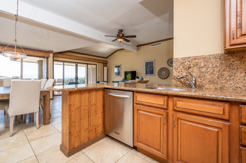 Cook, connect, and unwind in this beautifully appointed kitchen where timeless wood cabinets meet modern convenience