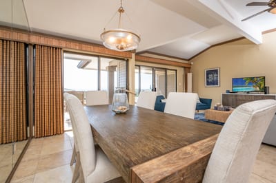 Share unforgettable meals in this charming space where natural wood textures meet soft neutral tones and warm lighting