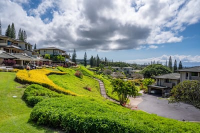 Enjoy vibrant tropical gardens, ocean vistas, and rolling hills—all from your peaceful hillside perch in paradise