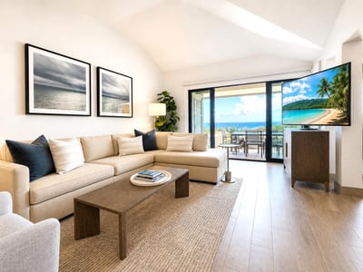 The updated living room is the perfect place to unwind after a day spent on the beach
