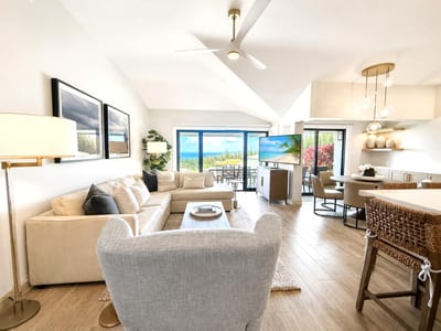 Bright open living room with ocean views and direct access to the lanai