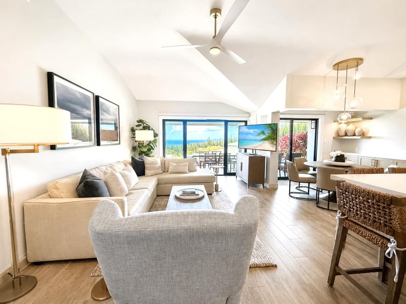 Bright open living room with ocean views and direct access to the lanai