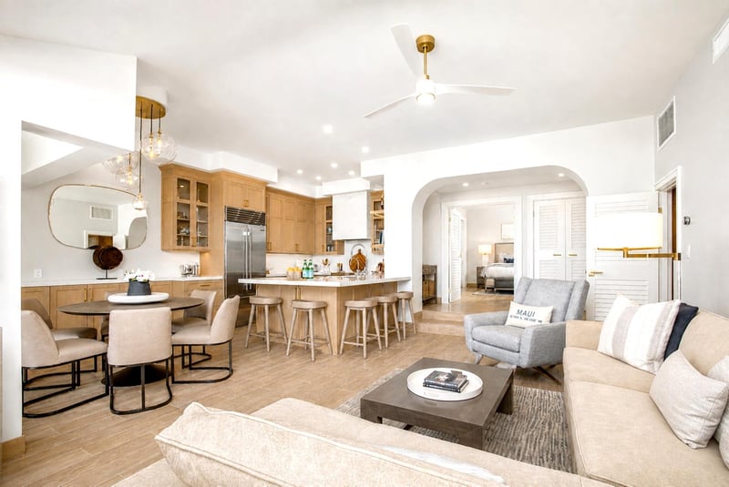 Warm open-concept living and dining with arched details
