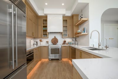 Blend, chop, sip, and stir—this sleek island kitchen turns daily cooking into a tropical symphony of stainless and sunshine