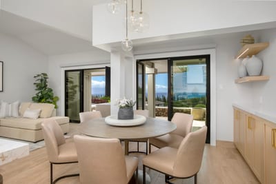 Dine beneath glass pendants and golden hour glow, where ocean views and warm wood tones turn meals into memories