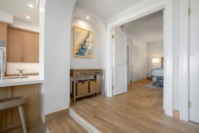 Feel instantly at ease in this beautifully curated space—where airy arches, soft textures, and warm wood invite rest