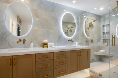 Bienvenue à votre spa privé—this master bath offers la dolce vita with gold accents and serene marble elegance