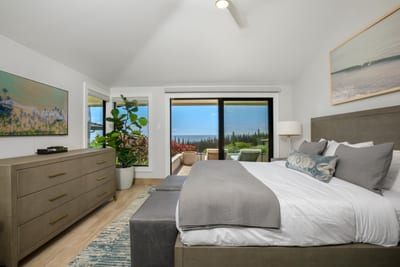 Sleek dressers, soft greys, and art that speaks of seascapes—this guest room is your secret escape into refinement