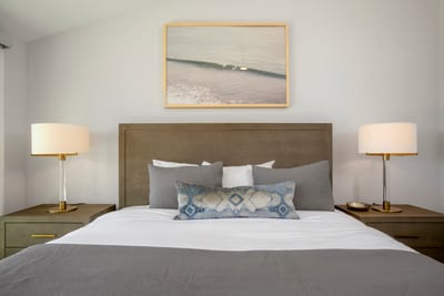 A touch of whimsy, a splash of coastal elegance, and a bed built for royalty—this space is made for dreamy nights
