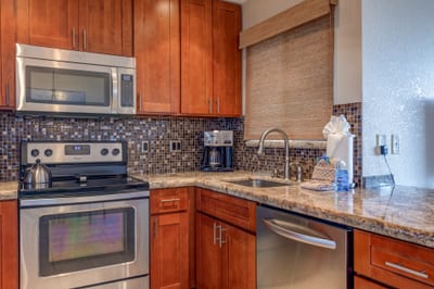 Designed for both ease and elegance, this fully stocked kitchen is your home base for island meals, snacks, and celebration prep