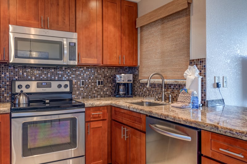 Designed for both ease and elegance, this fully stocked kitchen is your home base for island meals, snacks, and celebration prep