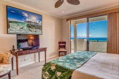 Step into island serenity in this oceanview suite, where lush accents and private lanai access invite peaceful moment