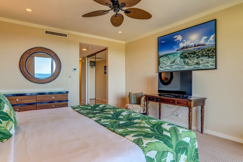 Where restful nights meet breezy mornings—this master bedroom offers direct lanai access and calming coastal charm