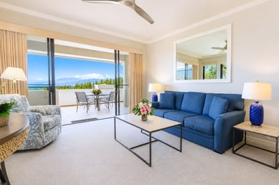 Sliding glass doors connect the living room to the lanai, blending indoor comfort with Maui's year-round breeze and ocean views.