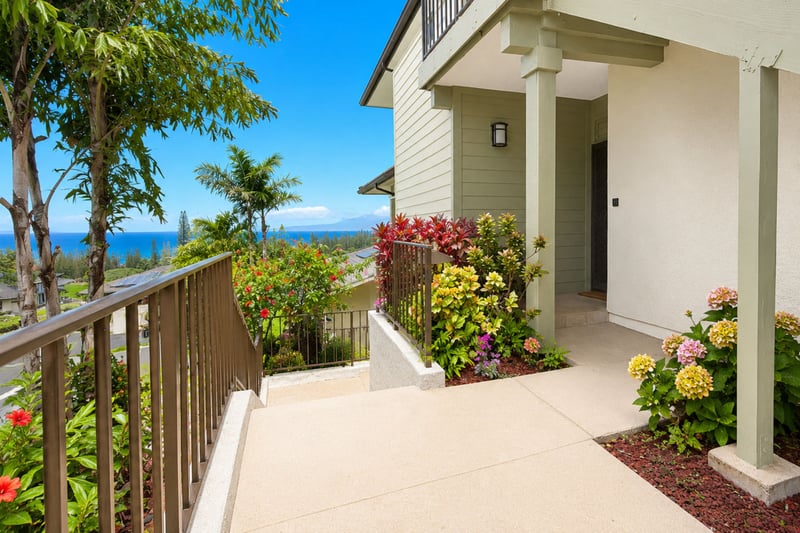 A lush, tropical walkway welcomes you home to KGV-23T1, with ocean views greeting you before you even reach the front door.