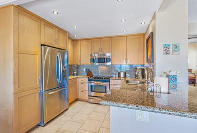 With stainless steel elegance and granite warmth, this kitchen is ready for both casual bites and celebration feasts KGV-24P2