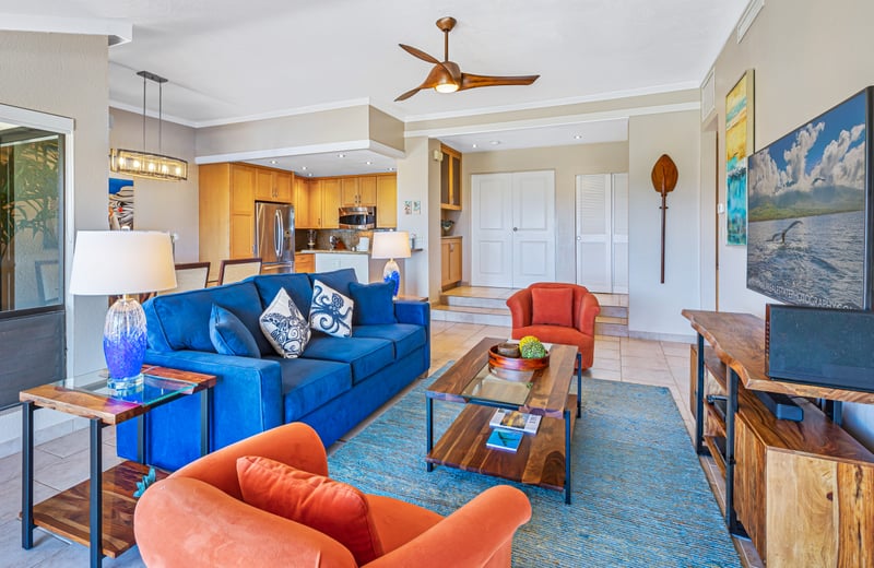 Colorful coastal living room with modern finishes and tropical flair.   