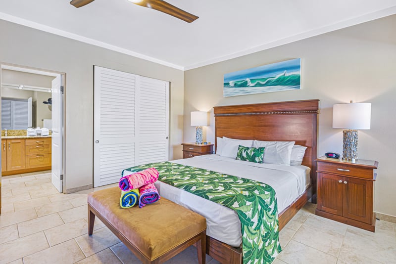 Tropical elegance meets comfort in this serene beachside bedroom retreat.