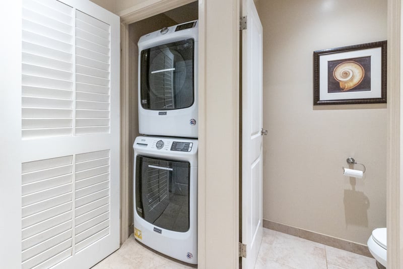 Travel Light, Wash Right: No need to overpack with this in-unit, guest-friendly laundry station 
